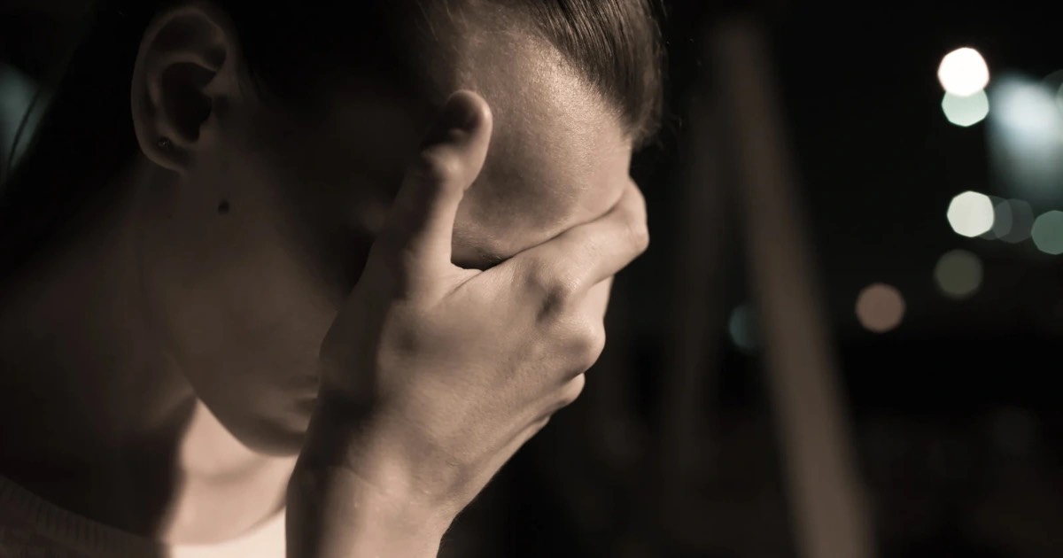 Image depicts the impact of teenage suicide on a teen who looks saddened 