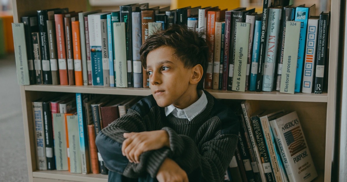 Student in image has been discriminated against and now keeps to himself.