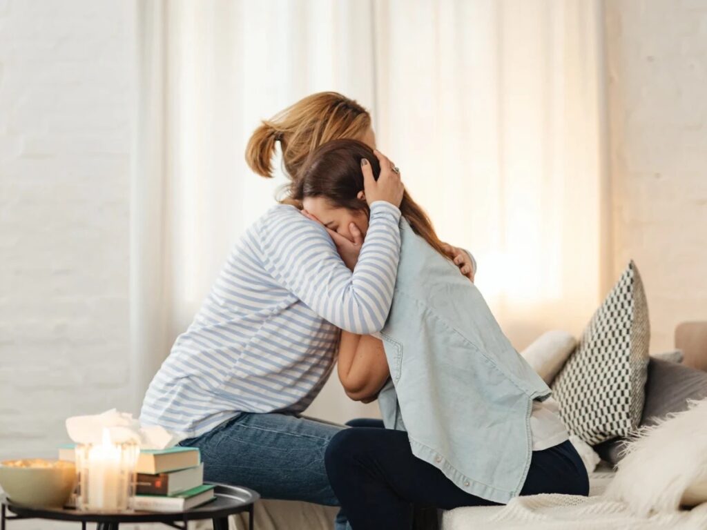 A mother guiding her daughter through the trauma rescue process as best she can.